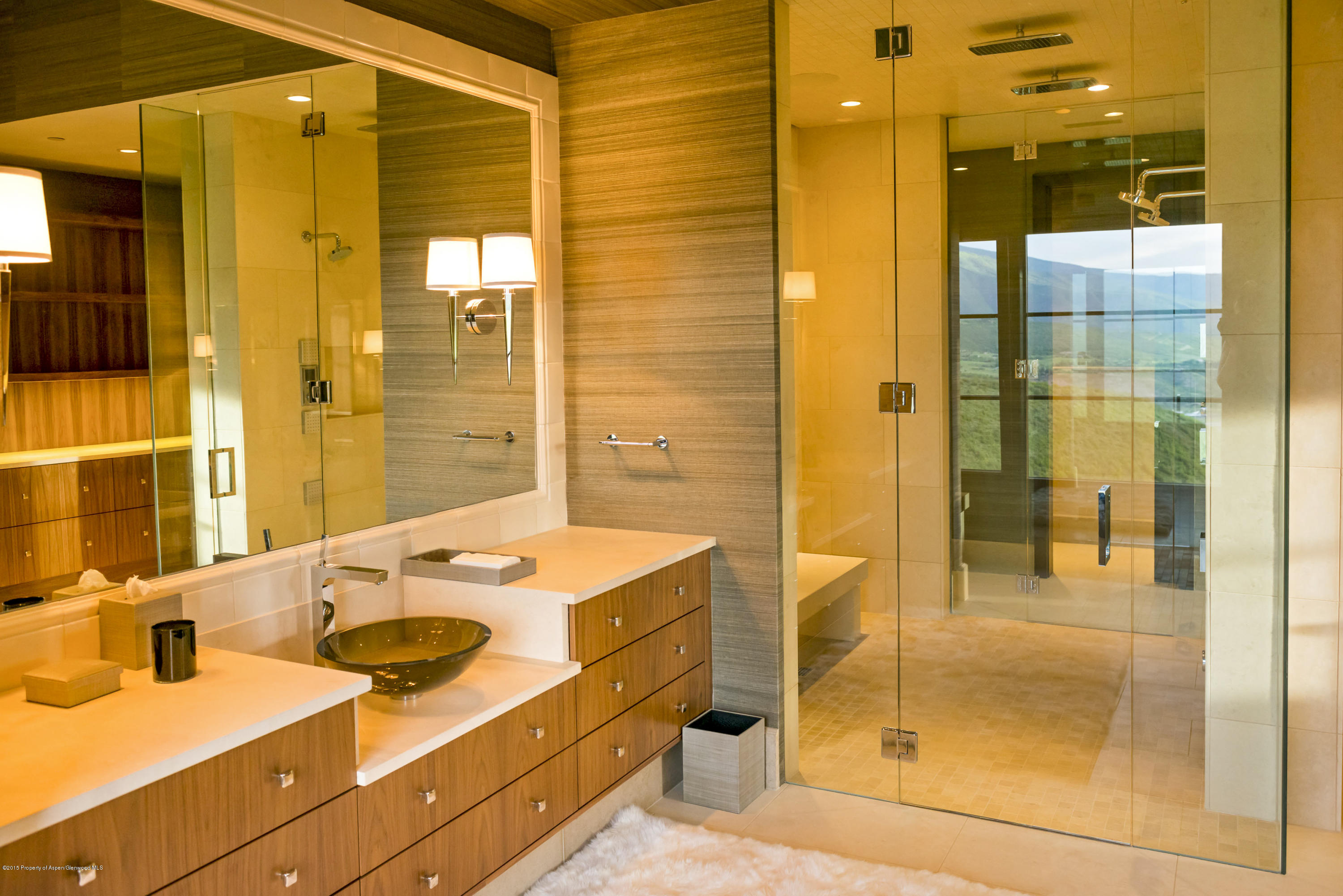 101 Oak Ridge Drive Aspen, CO 81611 - Photo 18 of 18 a bathroom with a shower sink and mirror