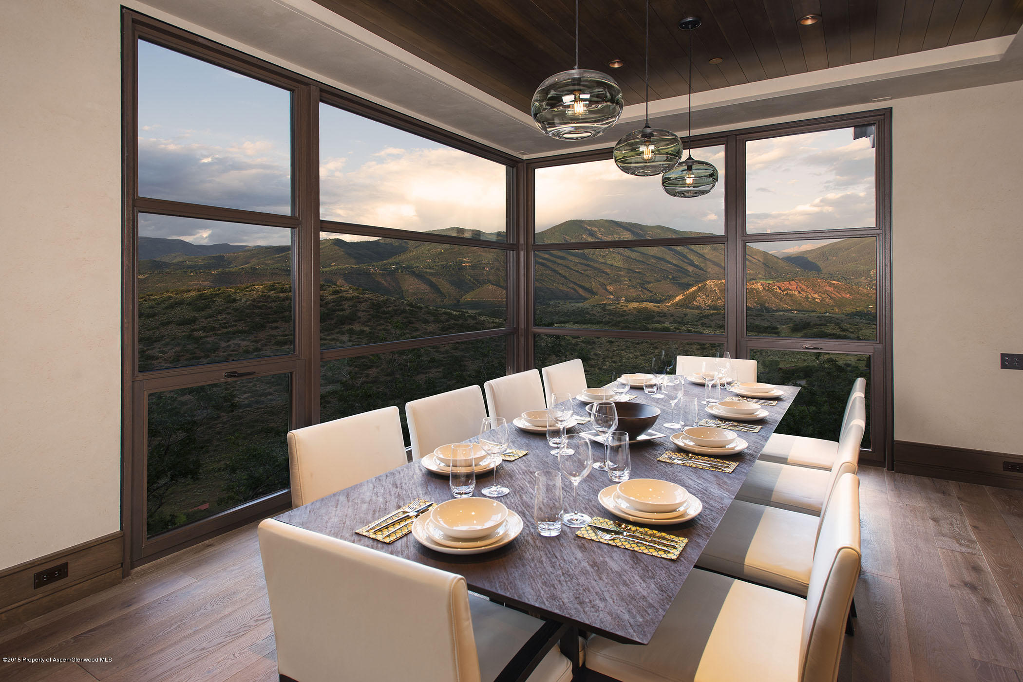 101 Oak Ridge Drive Aspen, CO 81611 - Photo 3 of 18 a dining room with furniture a chandelier and wooden floor