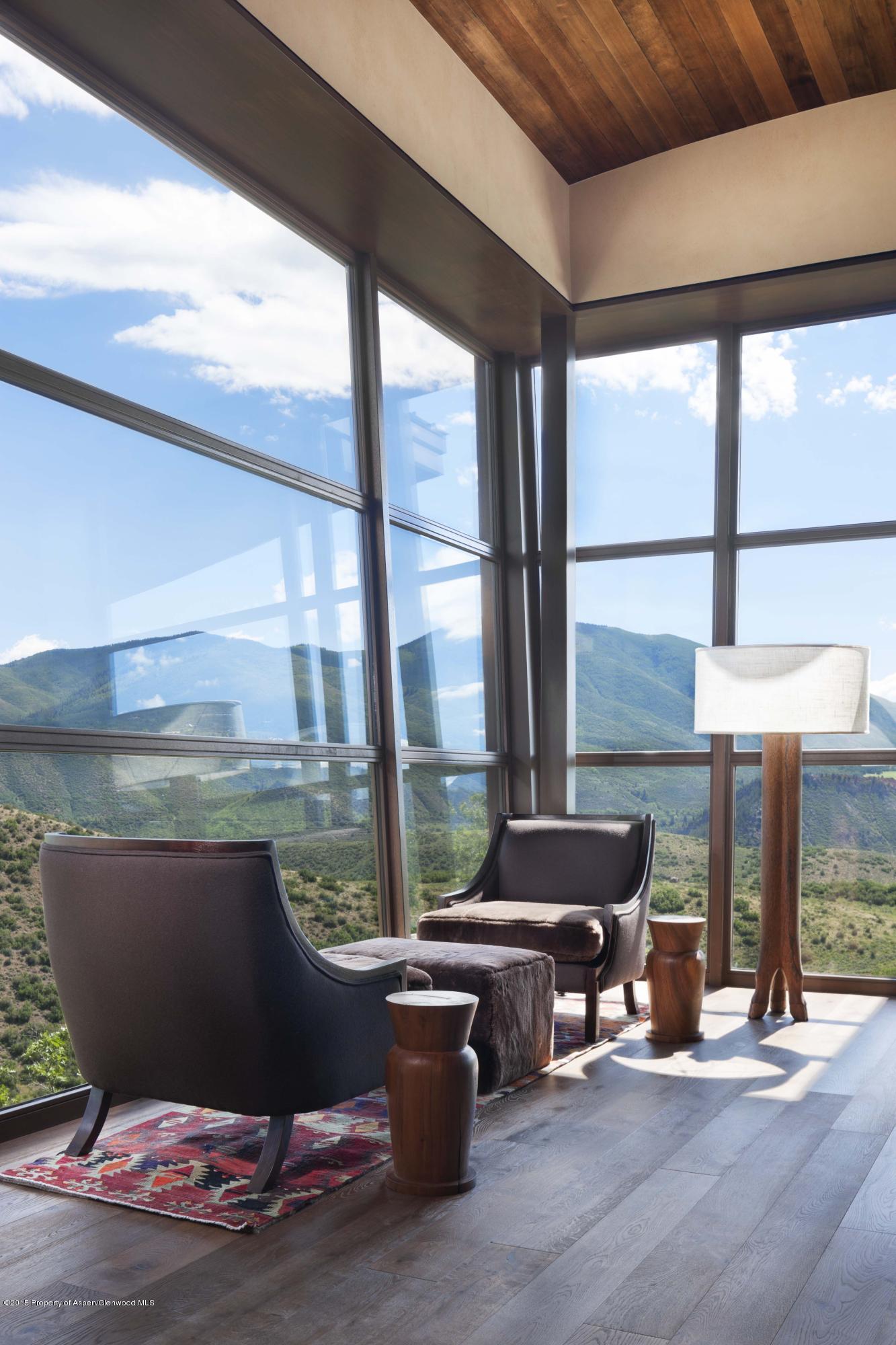 101 Oak Ridge Drive Aspen, CO 81611 - Photo 7 of 18 a living room with a table and chairs
