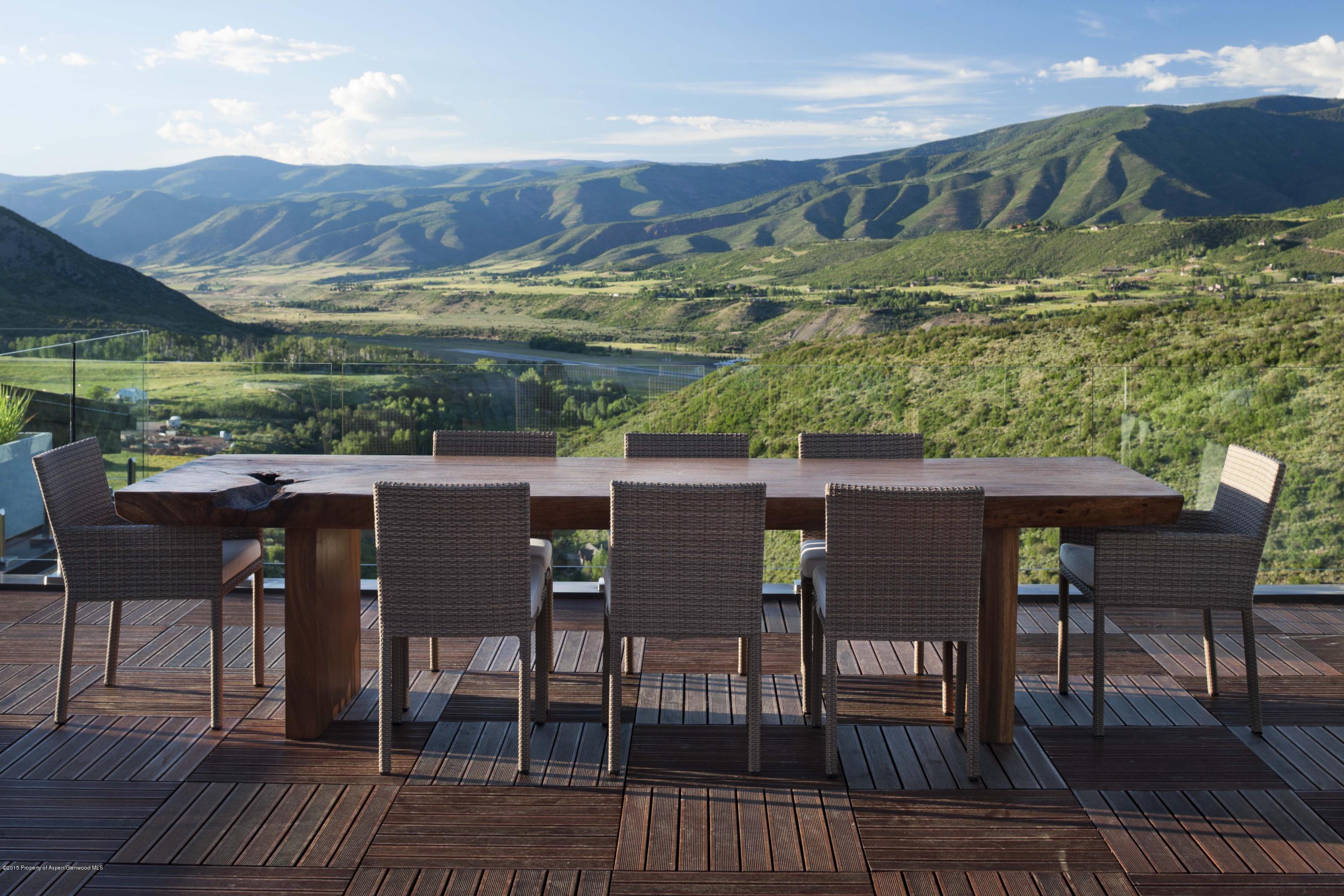 101 Oak Ridge Drive Aspen, CO 81611 - Photo 9 of 18 a view of a chairs and table on the wooden deck