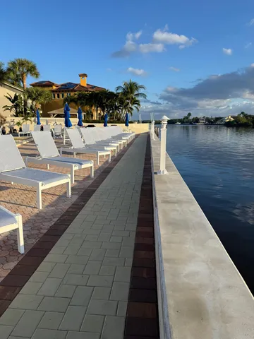 a view of swimming pool with outdoor seating and city view