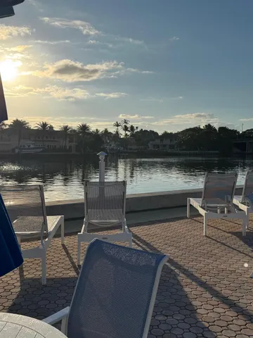 a view of a lake with outdoor seating