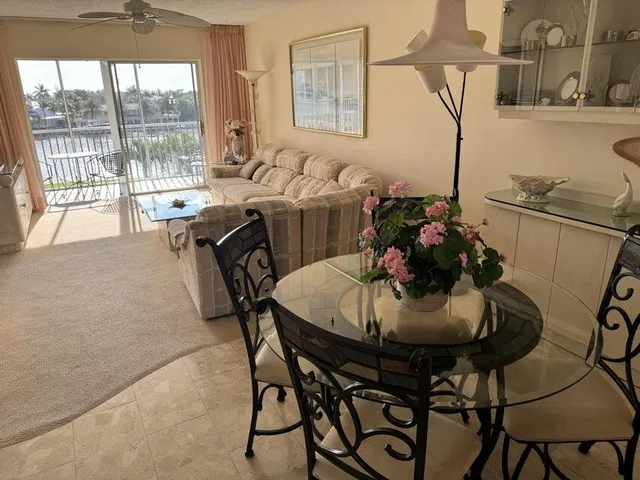 a dining room with furniture and window