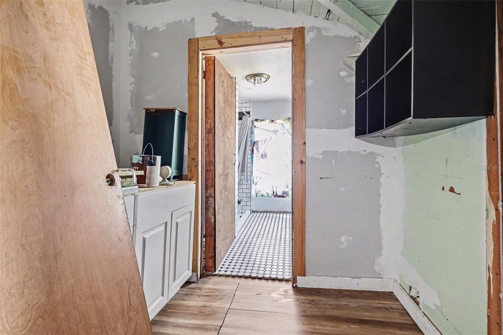 Undisclosed Address Frostproof, FL 33843 - Photo 17 of 22 a view of a bathroom from the hallway