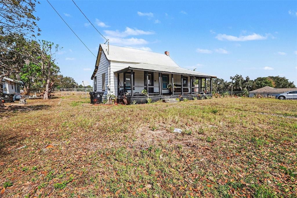 Undisclosed Address Frostproof, FL 33843 - Photo 2 of 22 a view of a house with large outdoor space and sitting area