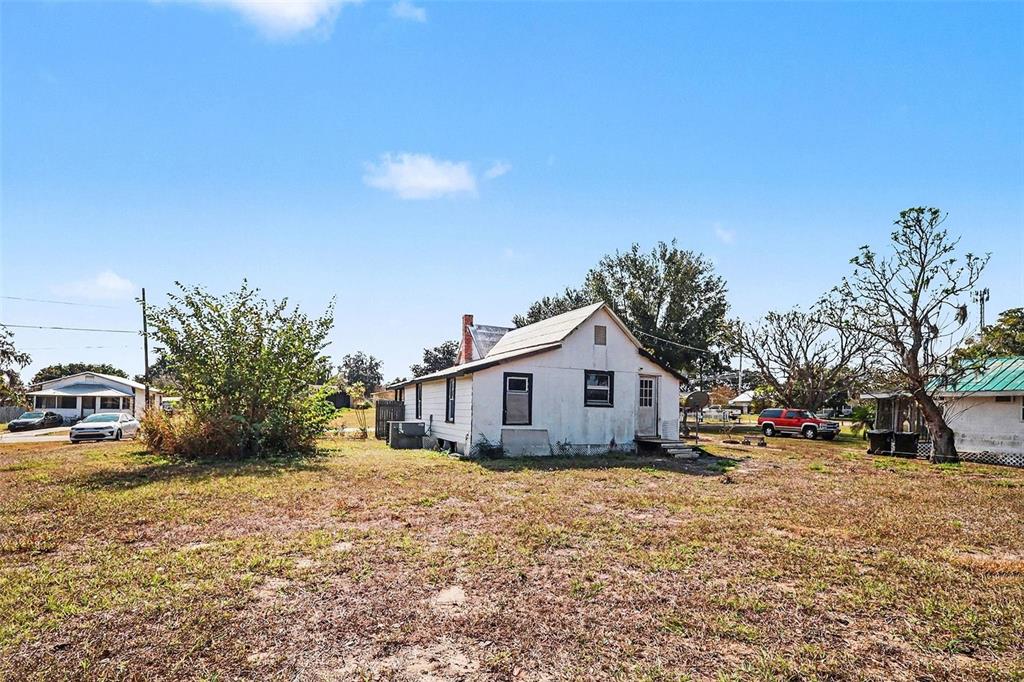 Undisclosed Address Frostproof, FL 33843 - Photo 22 of 22 a view of a house with a yard