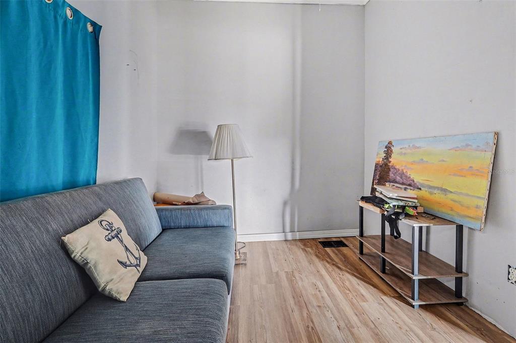 Undisclosed Address Frostproof, FL 33843 - Photo 5 of 22 a living room with furniture and a flat screen tv