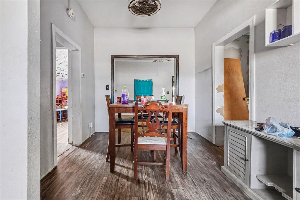 Undisclosed Address Frostproof, FL 33843 - Photo 8 of 22 a dining room with furniture and wooden floor