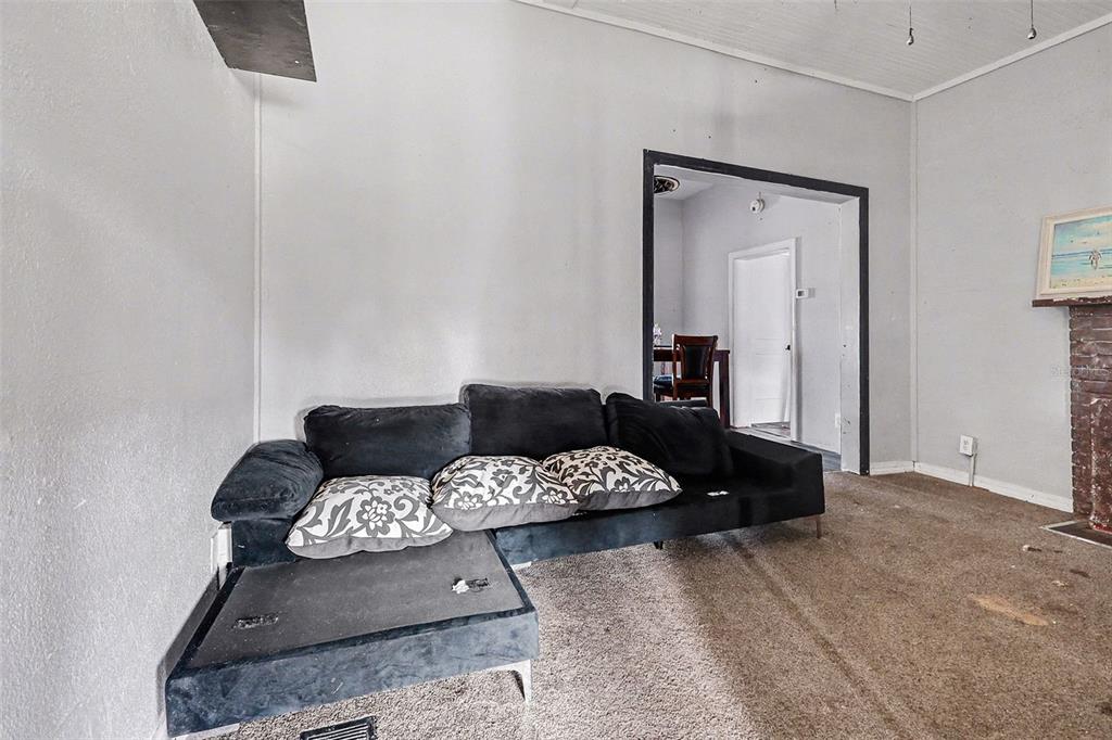 Undisclosed Address Frostproof, FL 33843 - Photo 9 of 22 a living room with furniture and a mirror