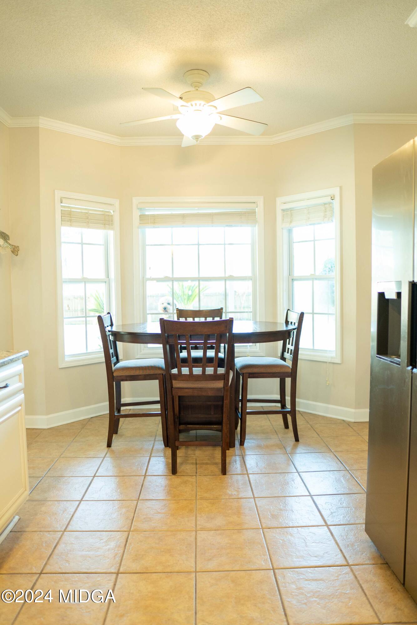 105 Windermere Circle Perry, GA 31069 - Photo 13 of 48 a dining room with furniture and window