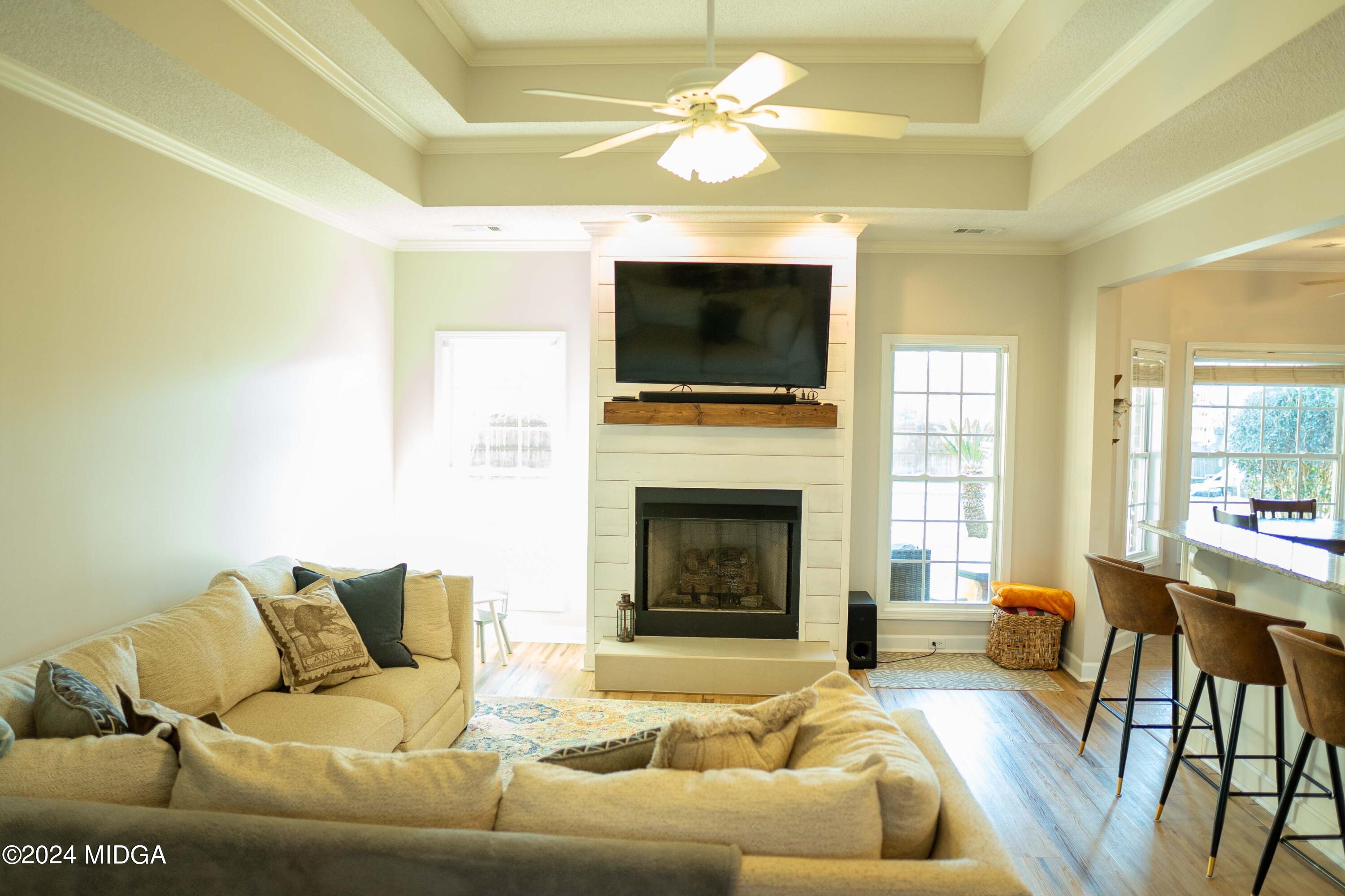 105 Windermere Circle Perry, GA 31069 - Photo 15 of 48 a living room with furniture fireplace and a flat screen tv