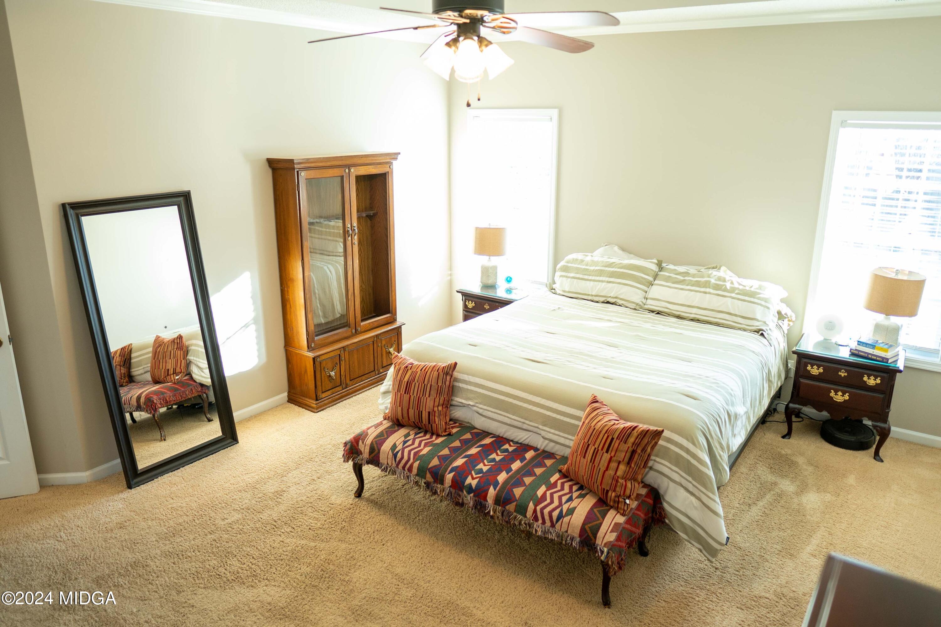105 Windermere Circle Perry, GA 31069 - Photo 18 of 48 a bedroom with a bed and a mirror