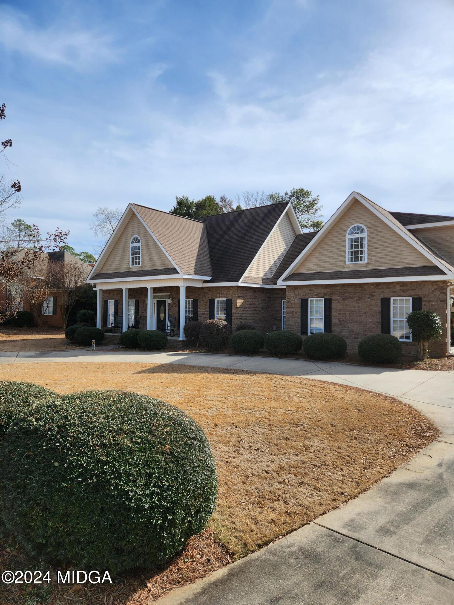 105 Windermere Circle Perry, GA 31069 - Photo 2 of 48 a front view of a house with a yard