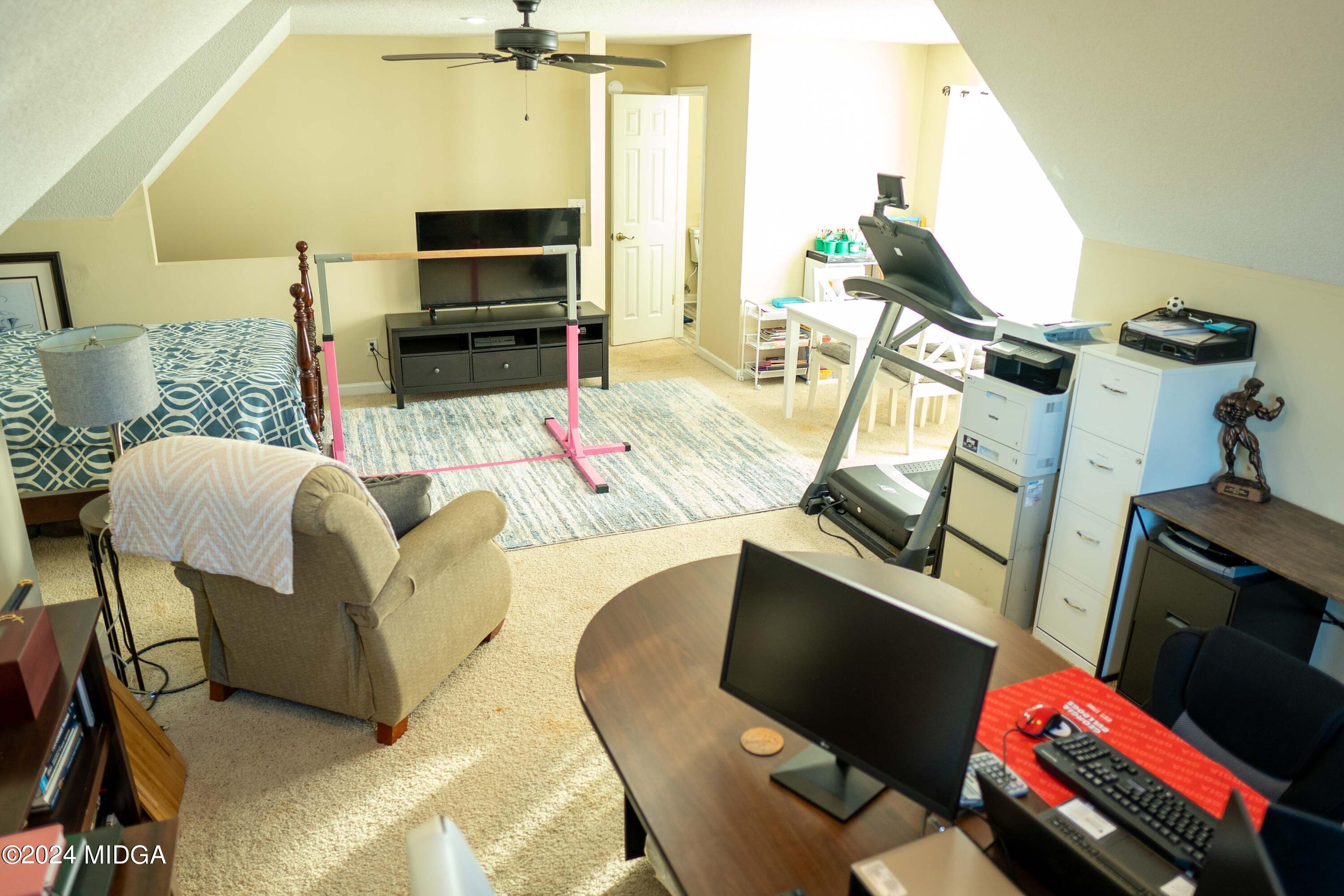 105 Windermere Circle Perry, GA 31069 - Photo 29 of 48 a living room with furniture and a flat screen tv