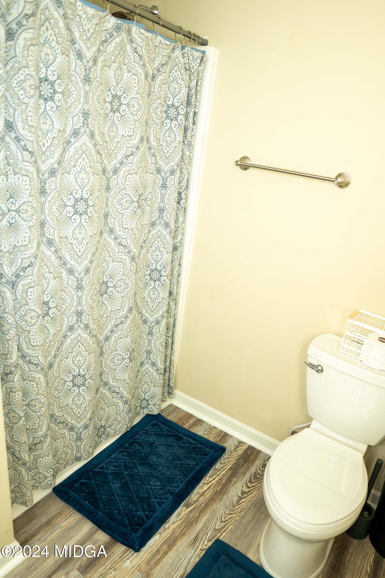 105 Windermere Circle Perry, GA 31069 - Photo 31 of 48 a bathroom with a toilet and a shower