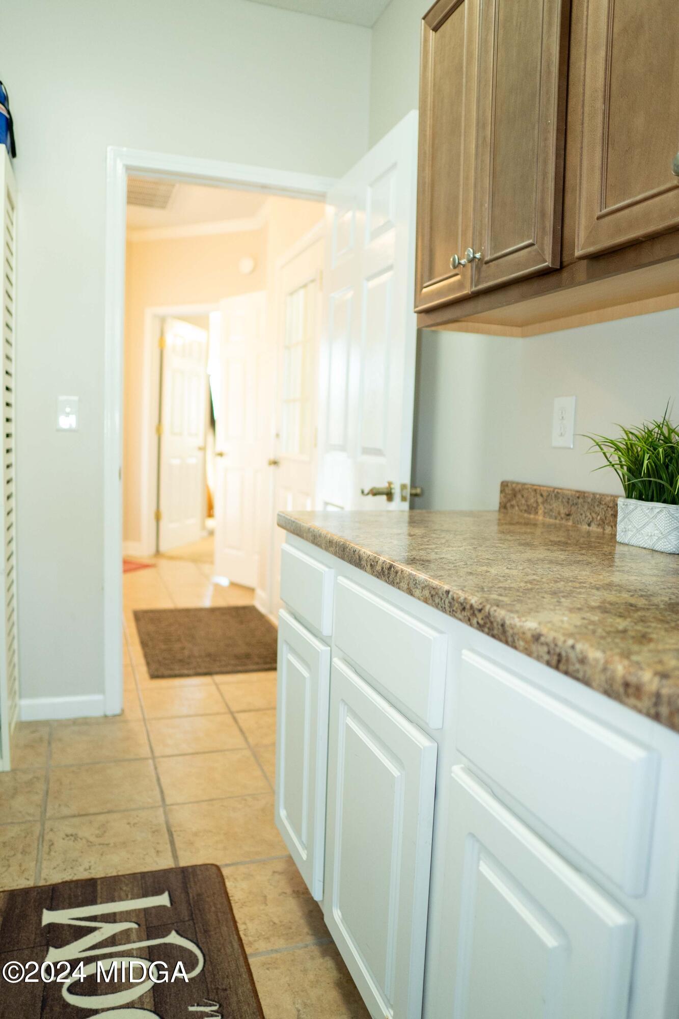 105 Windermere Circle Perry, GA 31069 - Photo 33 of 48 a kitchen with granite countertop sink and cabinets