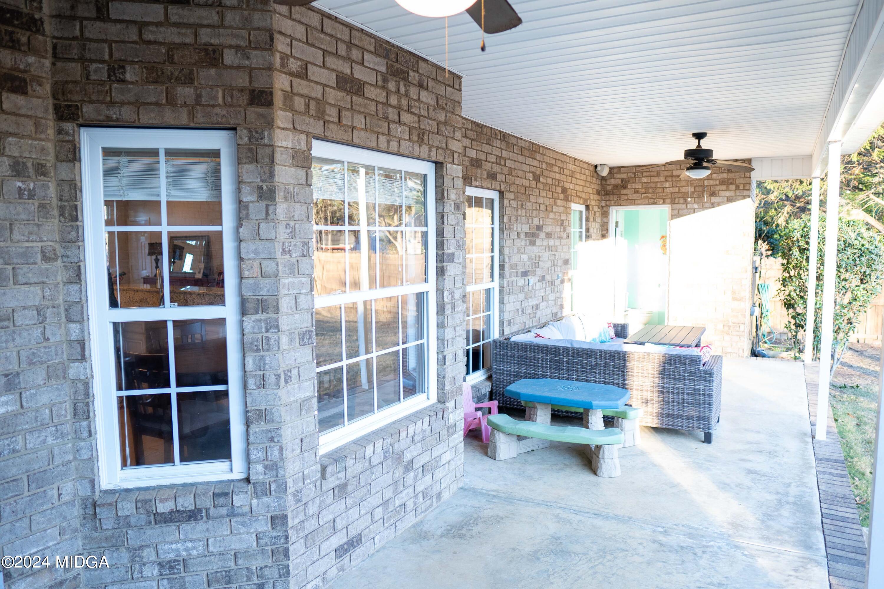 105 Windermere Circle Perry, GA 31069 - Photo 35 of 48 a backyard of a house with outdoor seating