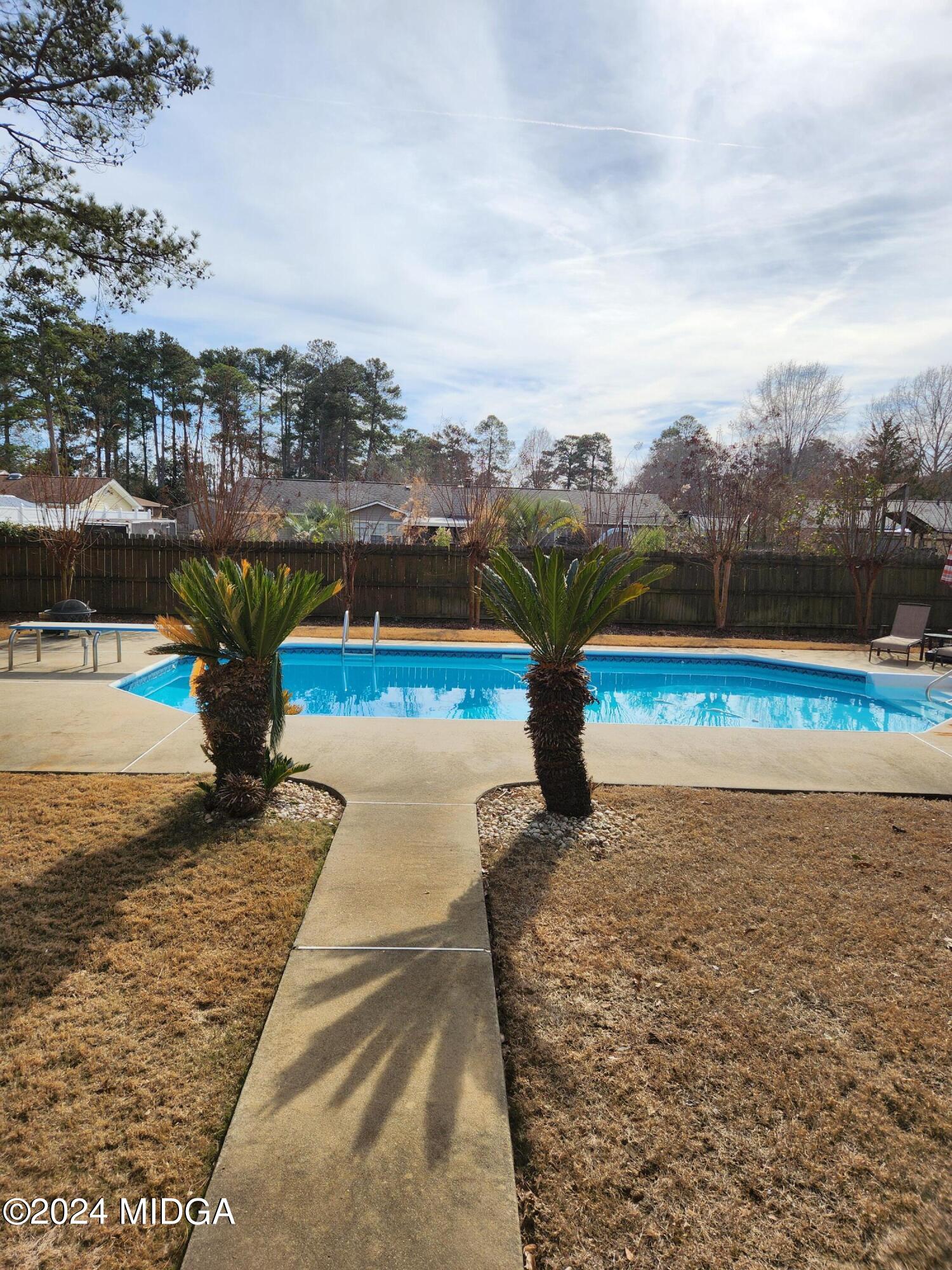 105 Windermere Circle Perry, GA 31069 - Photo 45 of 48 a view of a swimming pool with a lake view