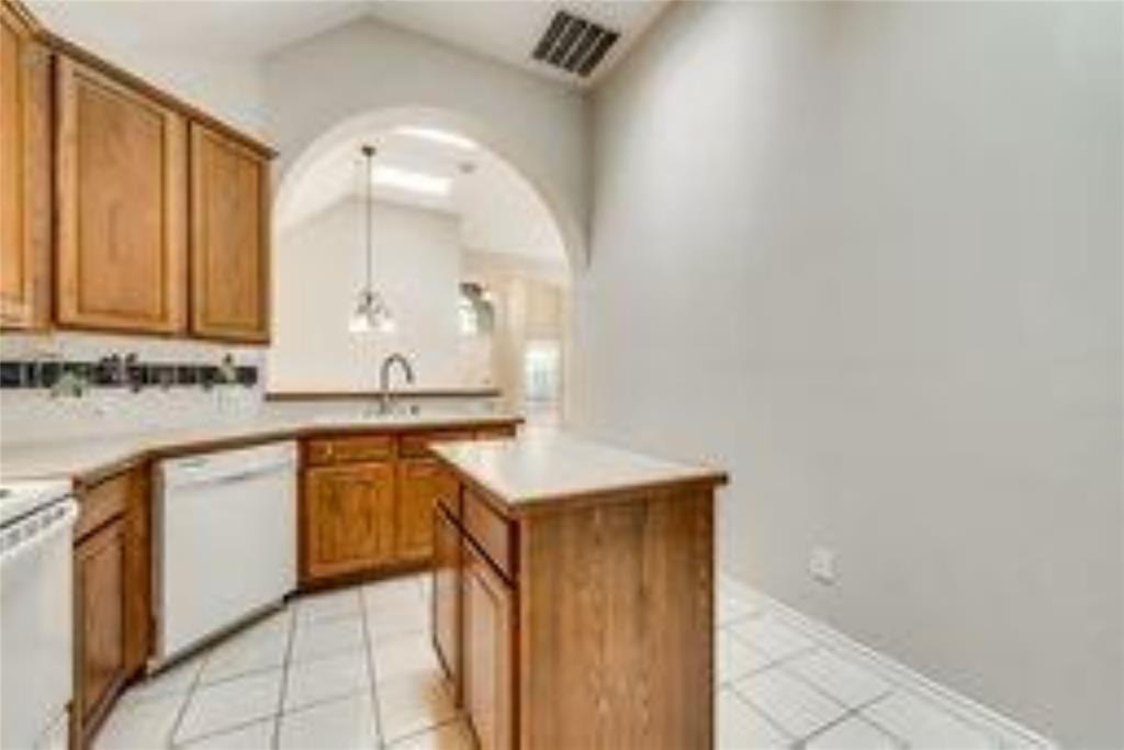 8417 Catskill Court Plano, TX 75025 - Photo 14 of 17 a bathroom with a sink a mirror and a bathtub