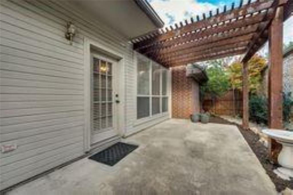 8417 Catskill Court Plano, TX 75025 - Photo 16 of 17 a view of a porch with wooden floor