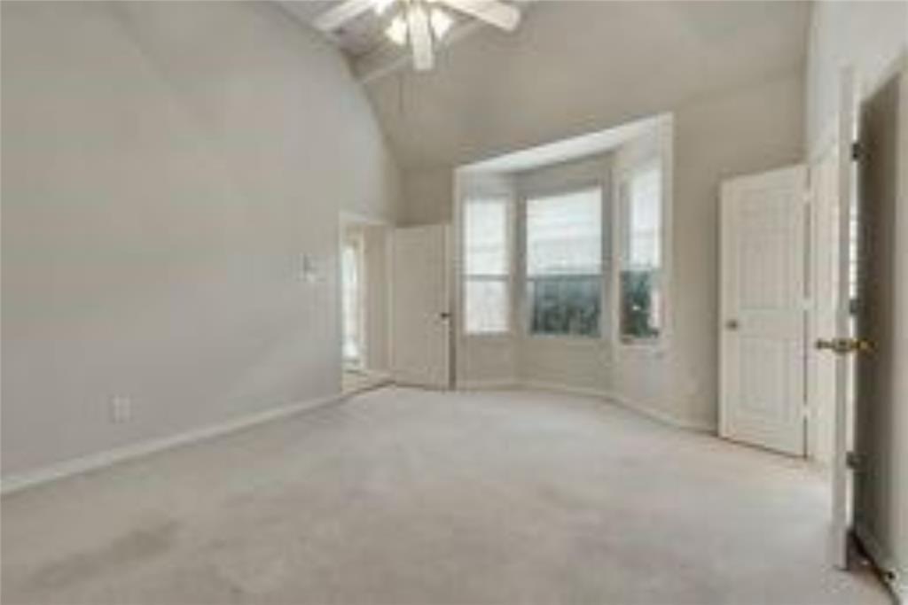 8417 Catskill Court Plano, TX 75025 - Photo 9 of 17 an empty room with chandelier fan