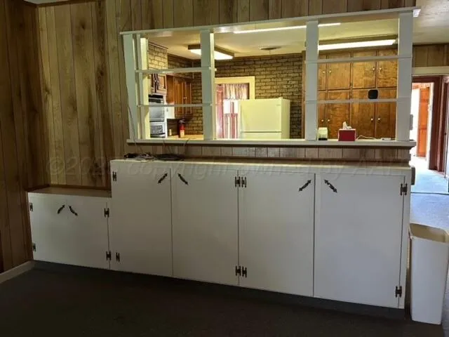 a view of a sink and a large mirror