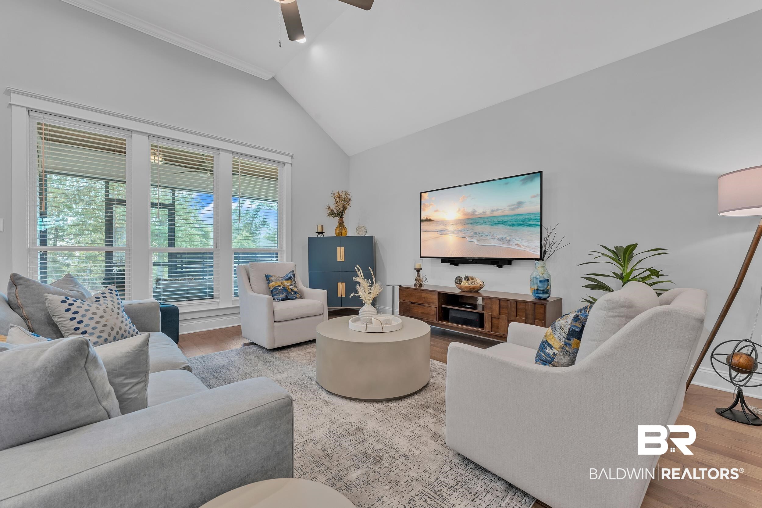 31630 Canopy Loop Daphne, AL 36527 - Photo 13 of 30 Living area featuring crown molding, a ceiling fan, wood finished floors, and lofted ceiling