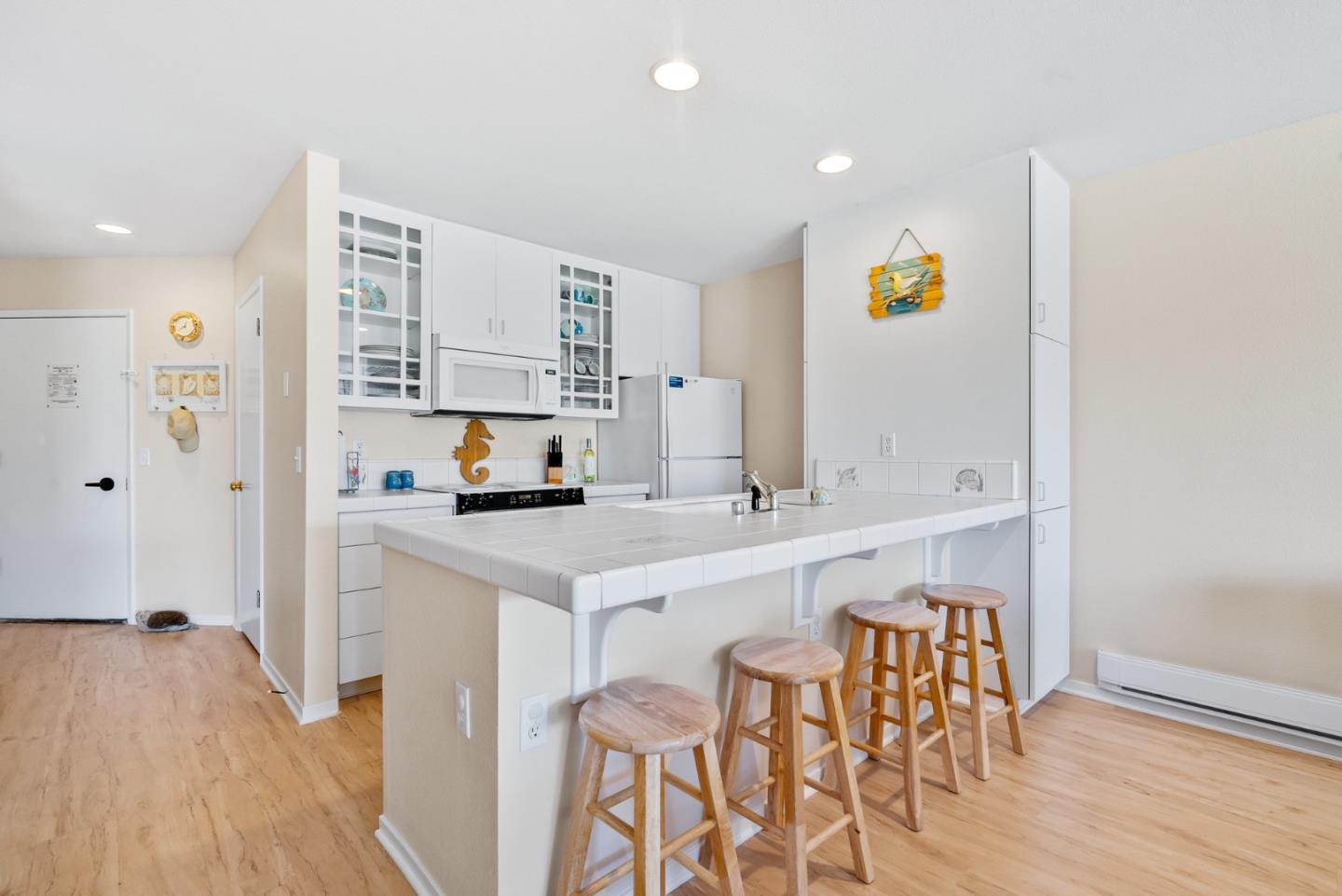 101 Shell Road, Unit 108 Watsonville, CA 95076 - Photo 16 of 38 a kitchen with a sink cabinets and wooden floor