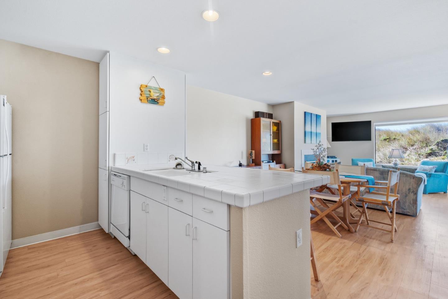 101 Shell Road, Unit 108 Watsonville, CA 95076 - Photo 17 of 38 a view of a kitchen with kitchen island a sink stainless steel appliances and cabinets
