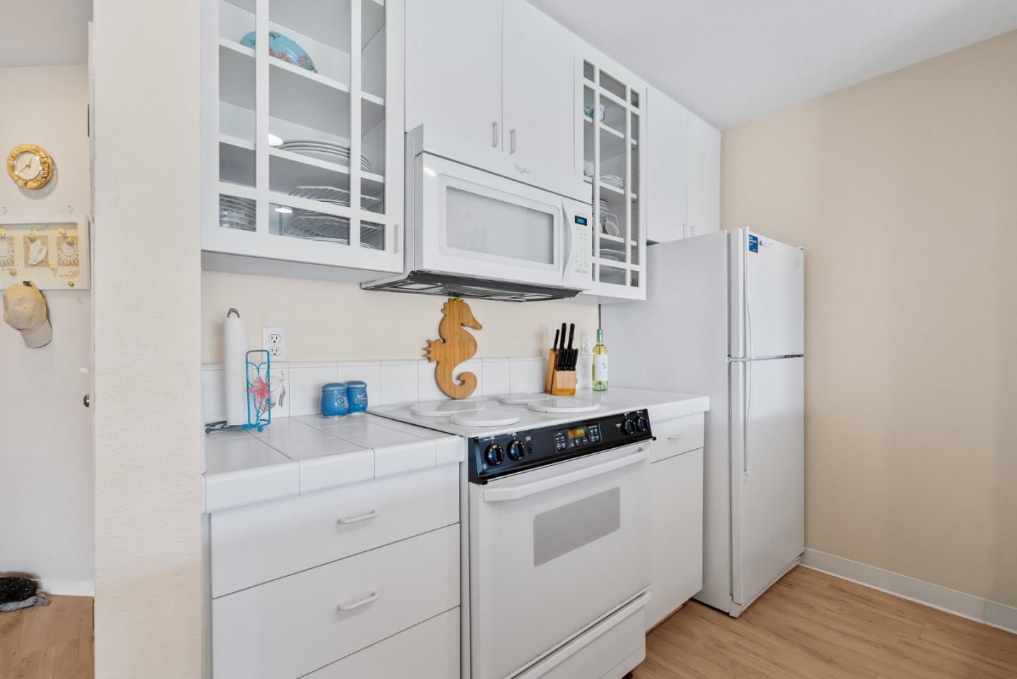 101 Shell Road, Unit 108 Watsonville, CA 95076 - Photo 19 of 38 a kitchen with stainless steel appliances cabinets and a potted plant