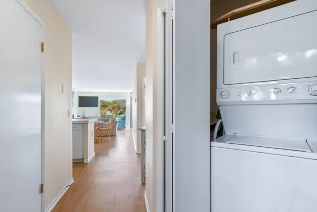 a view of a hallway with a living room