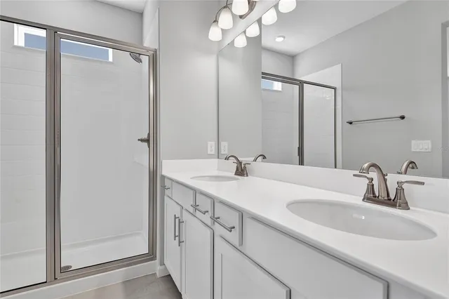 a bathroom with a sink vanity and a mirror