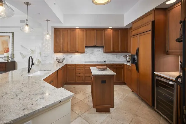 a kitchen with a sink stove and refrigerator