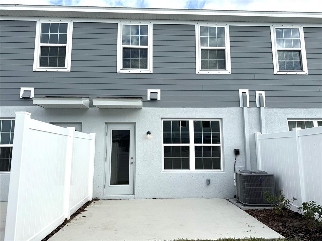 4612 Old Blush Street Lakewood Ranch, FL 34211 - Photo 17 of 19 a front view of a building with windows