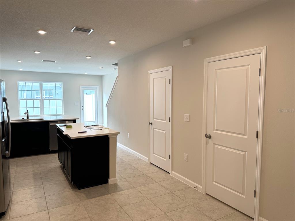 4612 Old Blush Street Lakewood Ranch, FL 34211 - Photo 4 of 19 a view of kitchen with window and refrigerator