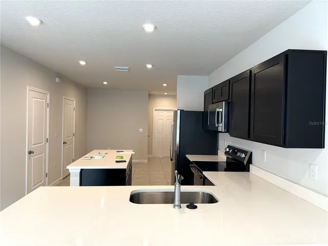 a large bathroom with a sink and a large mirror