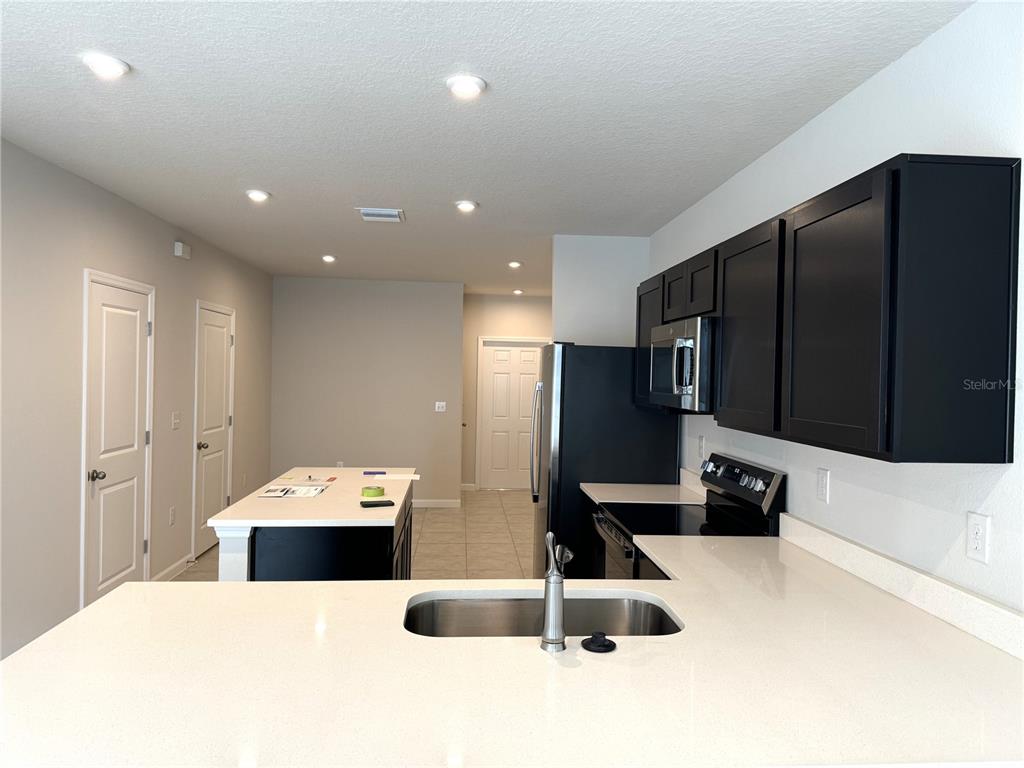 4612 Old Blush Street Lakewood Ranch, FL 34211 - Photo 5 of 19 a large bathroom with a sink and a large mirror