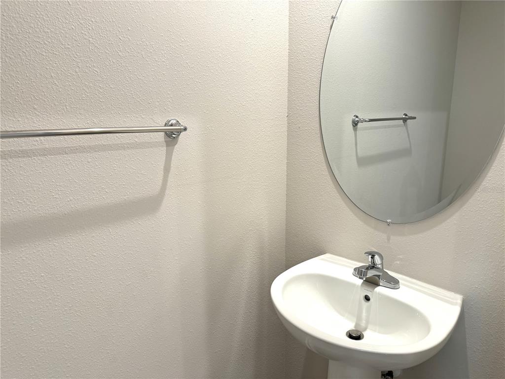 4612 Old Blush Street Lakewood Ranch, FL 34211 - Photo 8 of 19 a bathroom with a sink and a mirror