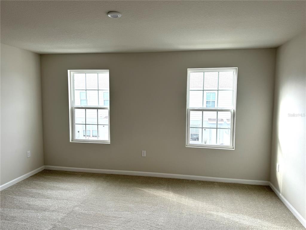 4612 Old Blush Street Lakewood Ranch, FL 34211 - Photo 10 of 19 an empty room with a window