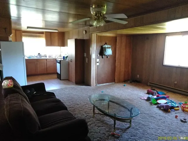a bedroom with furniture and a chandelier