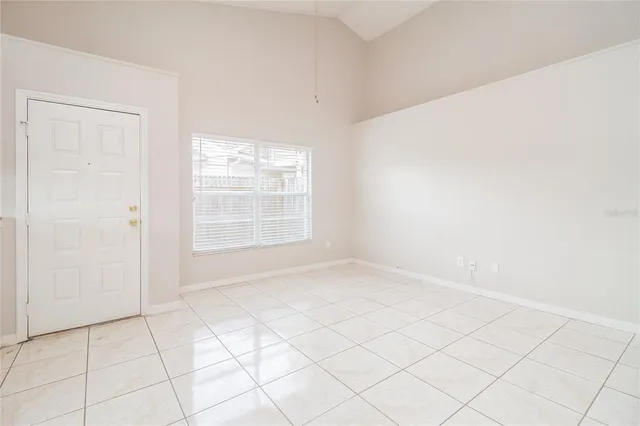a view of an empty room and window