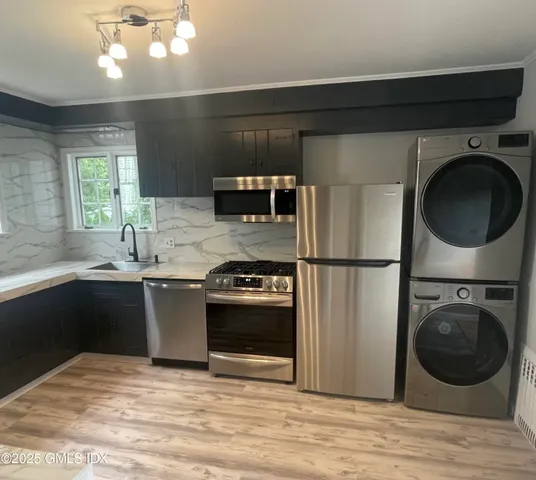 a kitchen with a refrigerator and a sink
