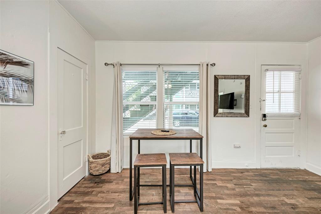 915 West 21st Street, Unit 2 Austin, TX 78705 - Photo 9 of 9 a workspace with wooden floor and a window