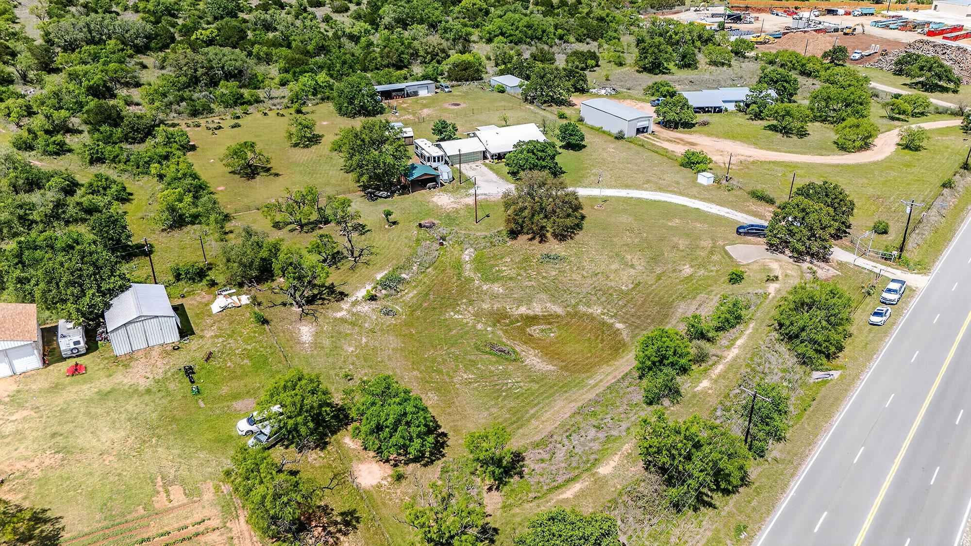 10465 Ranch To Market 1431 Buchanan Dam, TX 78609 - Photo 6 of 29 an aerial view of residential houses with outdoor space