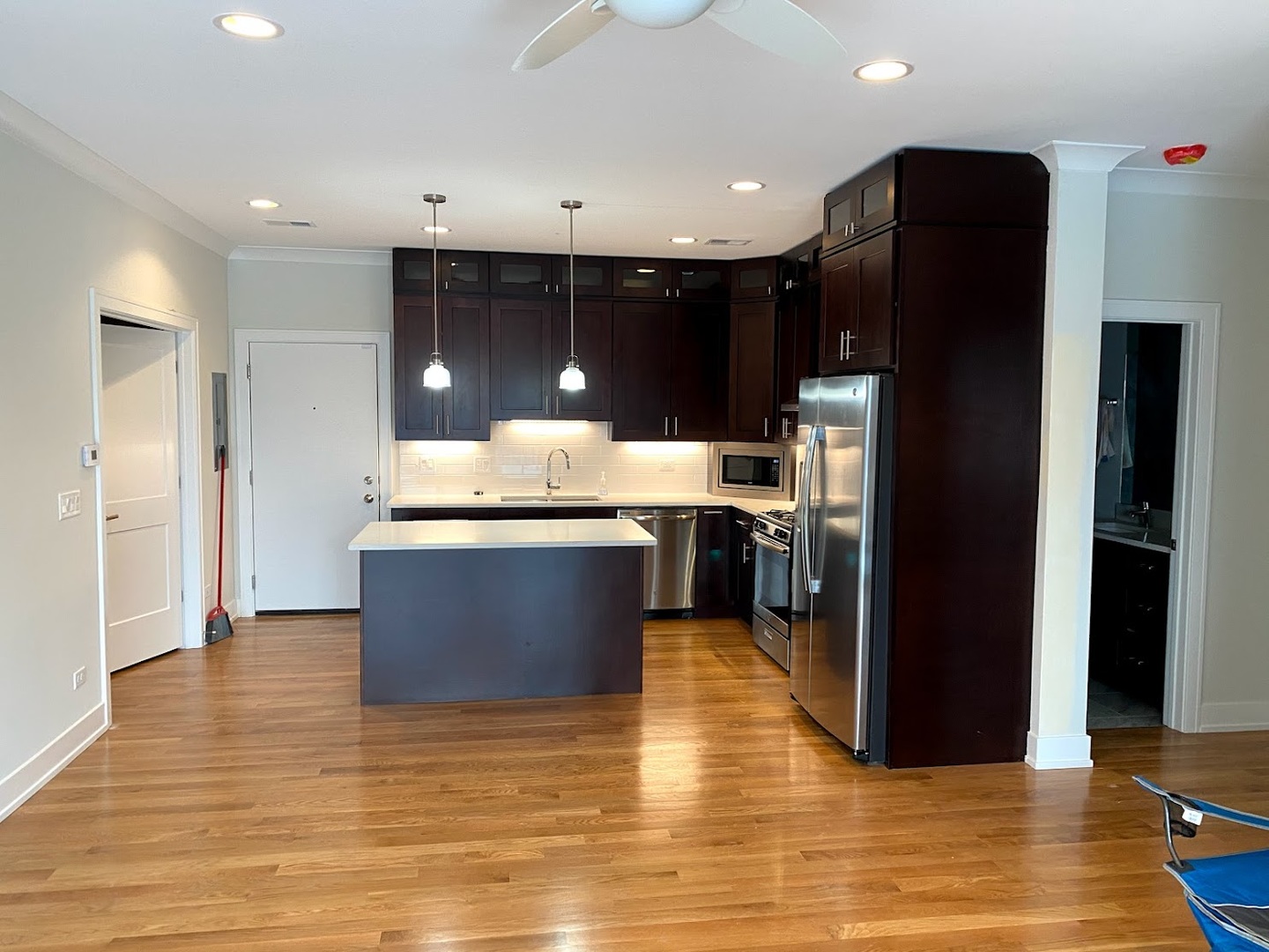 3203 North Ridgeway Avenue, Unit 2B Chicago, IL 60618 - Photo 2 of 17 a kitchen with stainless steel appliances granite countertop a refrigerator a sink and a stove