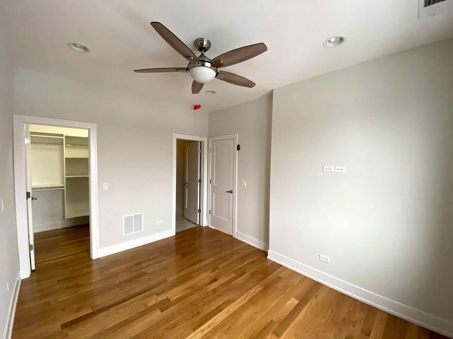 3203 North Ridgeway Avenue, Unit 2B Chicago, IL 60618 - Photo 8 of 17 a view of a livingroom with wooden floor and a ceiling fan