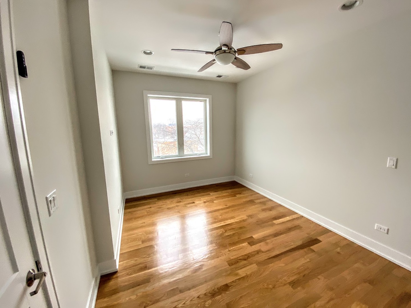 3203 North Ridgeway Avenue, Unit 2B Chicago, IL 60618 - Photo 9 of 17 a view of an empty room and wooden floor