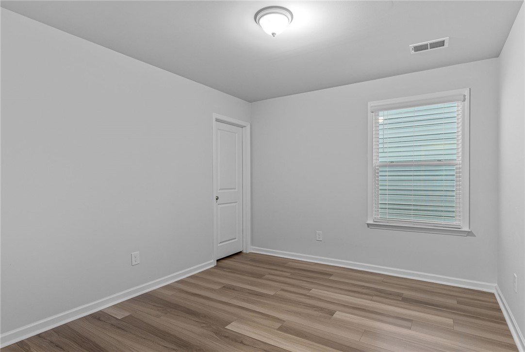 24 Chalet Court Anderson, SC 29621 - Photo 23 of 39 This bright room features durable flooring and a window offering natural light.