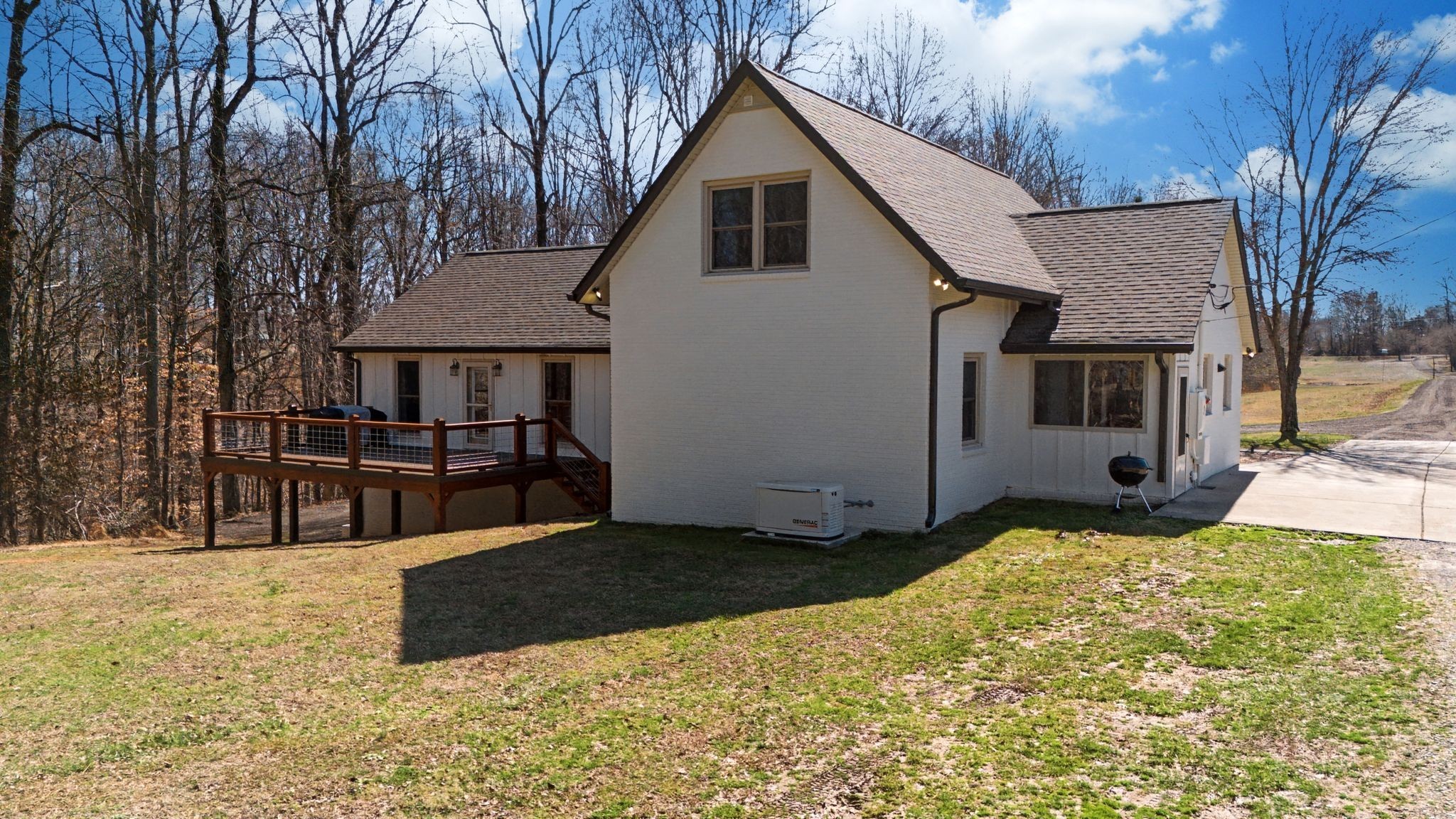 1231 Abiff Road Bon Aqua, TN 37025 - Photo 59 of 60 a view of a house with a yard covered in snow