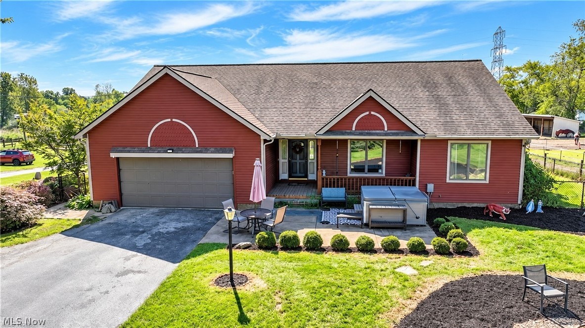 18 Manning Road Mogadore, OH 44260 - Photo 1 of 47 Red siding exterior with attached garage